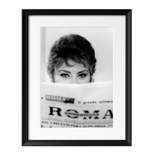 Sophia Loren reading newspaper (1961) - Framed Art - Multiframe